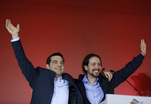 Greek head of Syriza party, Tsipras and Podemos party Secretary General Iglesias wave to supporters following a campaign rally in central Athen
